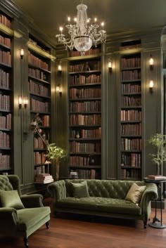 a living room filled with green couches and lots of book shelves full of books