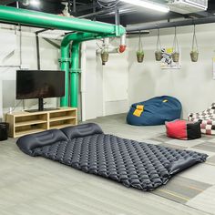 a living room filled with furniture and a flat screen tv