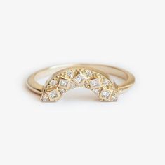 a gold ring with diamonds on it