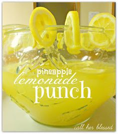 a lemonade punch in a glass with the words pineapple lemonade punch on it