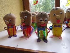 five stuffed animals are lined up on a table