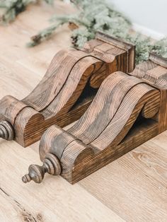 two wooden sleighs sitting on top of a hard wood floor