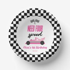 a black and white checkered paper plate with a pink car on it that says need four speed