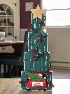 a christmas tree made out of wooden planks