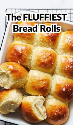 the fluffest bread rolls are in a white dish with text overlay that reads, the fluffest bread rolls