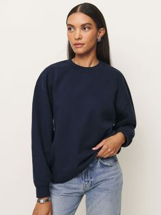 Shop the Emma Classic Crewneck Sweatshirt from Reformation, a relaxed sweatshirt with a crew neckline. Boxy Fit Crew Neck Top With Ribbed Collar, Blue Sweatshirt With Ribbed Neckline For Fall, Relaxed Fit Crew Neck Sweats With Ribbed Neckline, Boxy Fit Crew Neck Sweater With Ribbed Neckline, Crew Neck Sweatshirt With Ribbed Neckline And Relaxed Fit, Relaxed Fit Crew Sweatshirt With Ribbed Neckline, Relaxed Fit Sweatshirt With Ribbed Neckline, Boxy Crew Neck Sweatshirt For Everyday, Fall Boxy Crew Neck Top