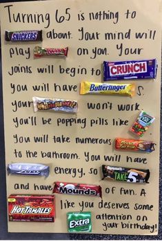 a paper sign with candy bars on it