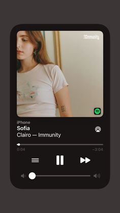 the music player is playing an album on her cell phone, and it's also showing