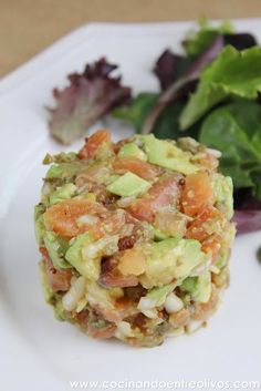 a close up of a plate of food with lettuce