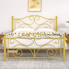 a yellow metal bed frame with white sheets and pillows on top of it, in a bedroom