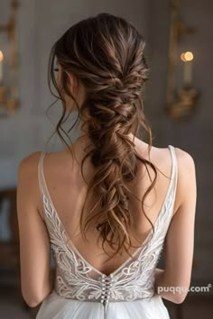 a woman with long hair in a wedding dress