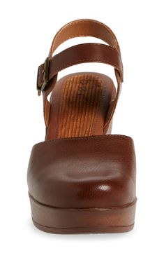 A woodgrain platform heel on a clog-inspired pump brings retro style to your ensembles. 3" heel Round toe Adjustable slingback strap with buckle closure Cushioned footbed Synthetic upper and lining, rubber sole Imported Brown Platform Slingback Pumps With Ankle Strap, Brown Slingback Pumps With Ankle Strap And Platform, Brown Leather Clogs With 4-inch Heel, Brown Platform Slingback Mules, Brown Platform Slingback Pumps, Brown Slingback Platform Mules, Brown Wedge Heel Clogs With Buckle Closure, Brown Slingback Pumps With Stacked Heel And Ankle Strap, Brown Wedge Heel Clogs With Heel Strap