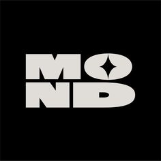 black and white logo with the letter m n d in large letters on a dark background