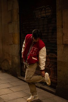 Varsity Jacket Photoshoot Men, Streetwear Red Outfit, Mens Style Tips, Red And Cream Outfit Men, Varsity Jacket Outfit Aesthetic Men, Red Outfits Men Aesthetic, Red Crewneck Outfit Men, Letterman Aesthetic, Sporty Guy Aesthetic