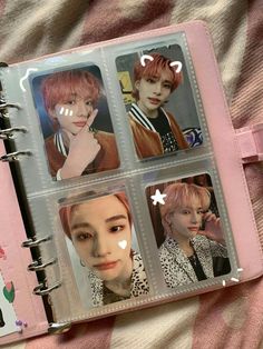 an open notebook with four pictures of btob members on it