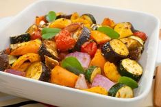 a white bowl filled with assorted veggies