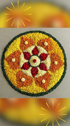 a flower arrangement made out of flowers on top of a white surface with yellow and red colors