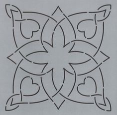 an intricate design with hearts in the center on a sheet of paper, ready to be cut