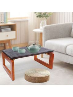 a coffee table with two bowls on it