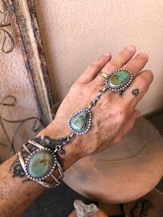 Native American Jewelry Turquoise & Silver Cuff to Ring st by Navajo Brenda Jimenez Chatfields Jewelry Navajo fits most  Nevada Turquoise  Genuine Navajo handmade cuff to ring set!  Freshly created entirely by hand in her traditional Navajo manner, by Brenda Jimenez. She chose 3 stunning and high grade turquoise stones from the Crow Springs mine in Nevada, USA (about 30 miles as the Crow flies, from the Royston mine). A beautiful piece of heirloom Native American jewelry and culture.   One size Vintage Navajo Jewelry, Turquoise Stone Jewelry, Navajo Turquoise Jewelry, Simple Beaded Necklaces, Silversmithing Jewelry, Cowgirl Accessories, Nevada Usa, Turquoise Jewelry Native American, Jewelry Turquoise