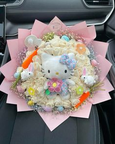 a hello kitty bouquet in the back seat of a car