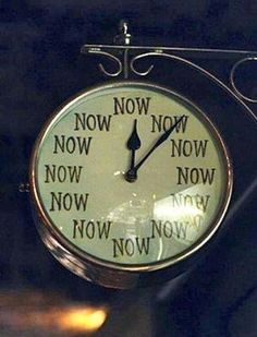 a clock with the words now on it