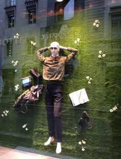 an image of a mannequin in the window of a clothing store