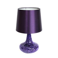 a purple table lamp with a black shade on the base and a white light behind it