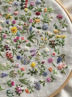 an embroidery project with flowers on it