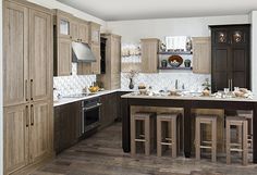 a large kitchen with wooden cabinets and counter tops, along with an island in the middle