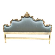 a gold and blue upholstered bed frame