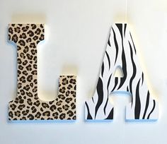 the letters are made out of wood and decorated with animal print