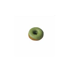 a green donut sitting on top of a white surface