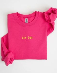 a pink sweatshirt with the words,'born to be fabulous'printed on it