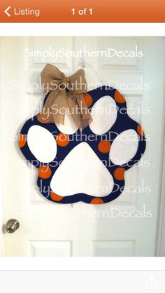 a door hanger with a dog's paw on it