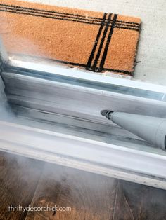 a blow dryer sitting on top of a window sill next to a door