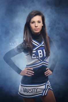 a beautiful young woman wearing a cheer uniform