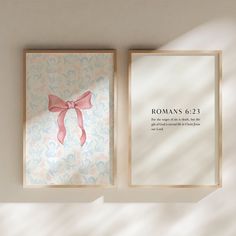 two framed pictures with pink bows and the words romans 9 23 are displayed in front of a white wall