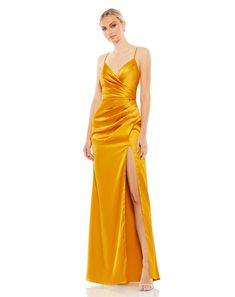 Ieena for Mac Duggal  Satin fabric (100% polyester) Fully lined through body V-neckline Spaghetti straps Faux wrap bodice Gathered waist featuring ruching at bodice and skirt Thigh-high front slit Concealed back zipper Approx. 62.5" from top of shoulder to bottom hem  Available in Marigold (dark yellow) and Platinum (s Romantic Dream, Stylish Jumpsuit, Sheath Gown, Spaghetti Strap Prom Dress, Unique Prom Dresses, Mac Duggal, Yellow Fashion, Long Gown, Long Prom Dress