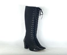 "1970s beautiful black suede and leather lace-up boots. The suede is on the body of the boot while the leather covers the toe and heel, making them durable. The heel is in polished black wood. They have a rounded squared-off toe, somewhat tall heel, and square chrome hooks with a deco pattern on them. Lightweight cream leather lining. Very well made. Original laces. Condition:  excellent vintage condition Label: no maker's mark Circa: 1970s Composition: suede and leather upper, wood heels, leather sole Color: black Size: labelled 38.5 Fits like: 8 (us) / 38.5 (eu) / 5.5 (uk)  Measurements: Length of insole: 9.75\" (24.7 cm)  Width of insole: 2.75\" (7 cm) Calf circumference: 13.75\" (33.7 cm) but expands Height: 17.5\" (44.5 cm) Heel: 2.75\" (7 cm)" Vintage Black Lace-up Heeled Boots, Fitted Suede Lace-up Boots, Fitted Lace-up Suede Boots, 70s Heels, Saddle Boots, Wood Heels, Goth Boots, Boho Boots, 2000s Grunge