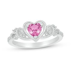 Who wouldn't love this darling lab-created gemstone heart ring? Sterling silver The ring features a 5.0mm heart-shaped pink lab-created sapphire center stone A milgrain detailed frame surrounds the heart Milgrain scrollwork dotted with white lab-created sapphires creates the ring's shank Valentine's Day Birthstone Ring With Diamond Accents, Heart-shaped White Gold Birthstone Ring For Valentine's Day, Pink Heart-shaped Ring With Diamond Accents, Pink Heart-shaped Rings With Diamond Accents, Pink Heart Cut Jewelry With Prong Setting, Pink Heart Ring In Cubic Zirconia, Fine Jewelry Style, Pink Sterling Silver Heart Ring With Center Stone, Pink Cubic Zirconia Heart Ring Fine Jewelry, Pink Heart Cut Diamond Accented Heart Ring