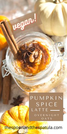 pumpkin spice latte overnight oats in a glass jar with cinnamon sticks on top