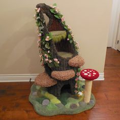 there is a mushroom house with flowers on it