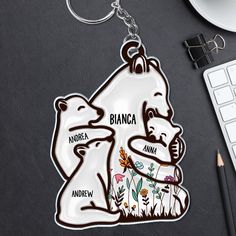 an animal keychain with the name bianca and two bears on it