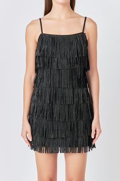 This Embellished Faux Suede Fringe Mini Dress is perfect for a night out on the town. With its sleeveless design, fringed detail, and embellished accents, this dress is sure to turn heads. Whether you're hitting up a club or going to a fancy dinner, this mini dress is a great choice. You'll look and feel fabulous in this amazing dress. Faux suede Adjustable straps Fringe detail torso Mini length Sleeveless Lined Hand wash cold Do not bleach Do not tumble dry Do not dry clean Do not iron Shell: 5 Suede Mini Dress, Fringe Mini Dress, Rhinestone Dress, Fancy Dinner, Suede Fringe, Night Out On The Town, Out On The Town, Hip Length, Mini Black Dress