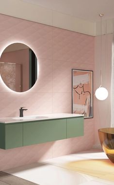 a bathroom with pink walls and green counter top, round mirror on the wall next to it