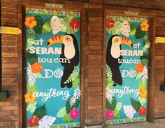 two doors decorated with flowers and birds on the side of a brick building that says, at seran touca can do anything