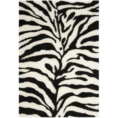 a zebra print rug with black and white stripes