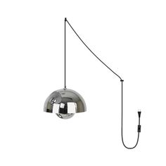 a chrome ball hanging from a black cord on a white wall with a light attached to it