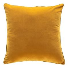 a yellow pillow on a white background